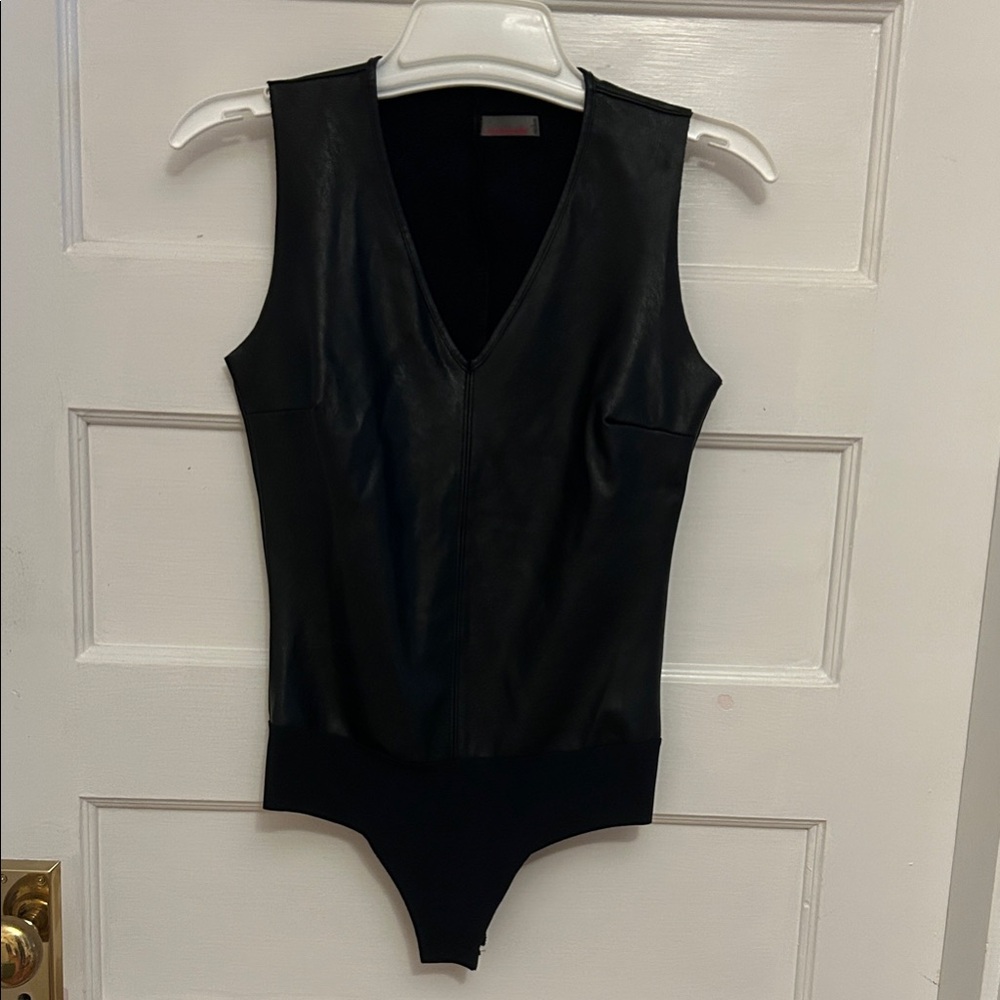 Black Commando One Piece faux leather. V-neck